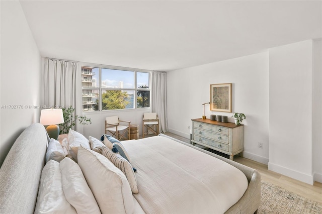 bedroom with light hardwood / wood-style floors