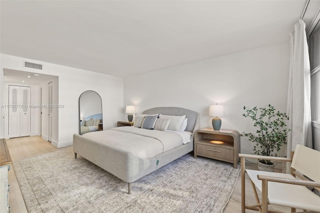 bedroom with light wood-type flooring