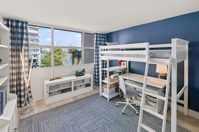 bedroom with hardwood / wood-style floors