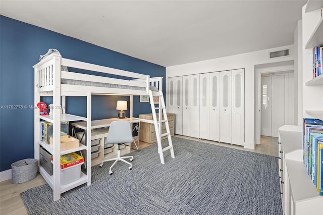 bedroom featuring a closet and hardwood / wood-style floors