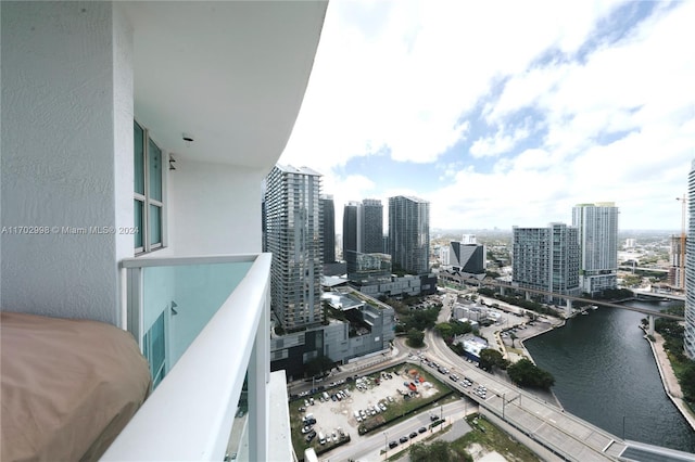 balcony featuring a water view