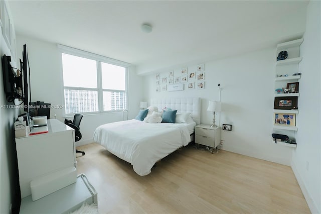 bedroom featuring light wood-type flooring