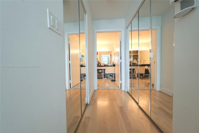 hallway with light wood-type flooring