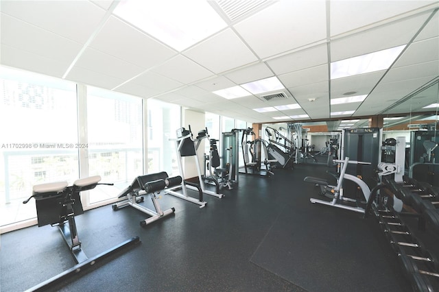 workout area with a drop ceiling