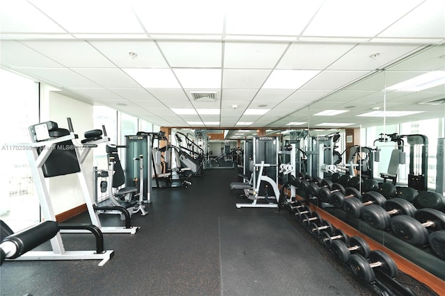 exercise room with a drop ceiling