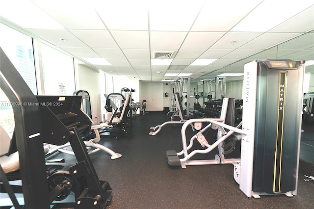 exercise room with a drop ceiling