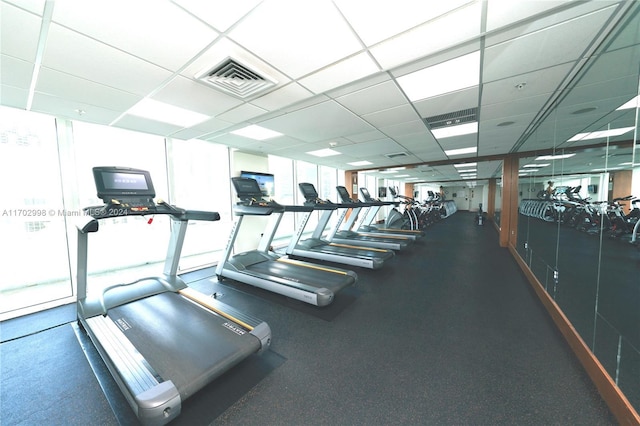 gym featuring a paneled ceiling