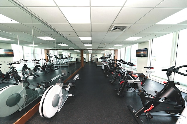 exercise room featuring a drop ceiling