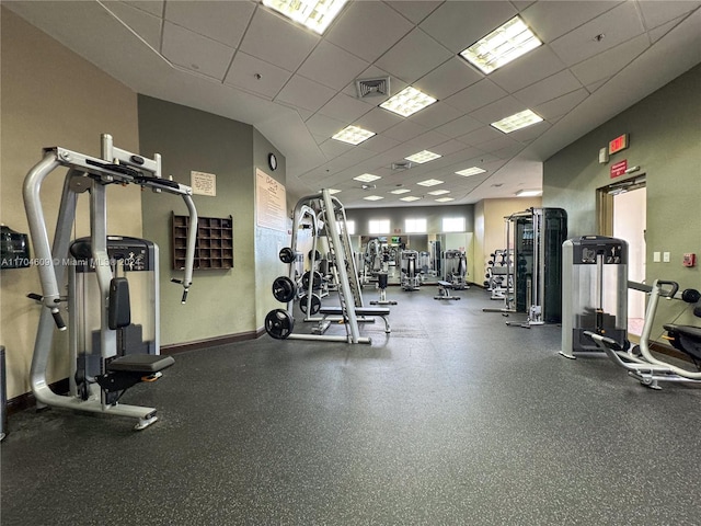 gym featuring a drop ceiling