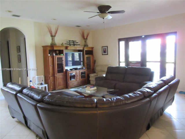 living room featuring ceiling fan and light tile patterned flooring