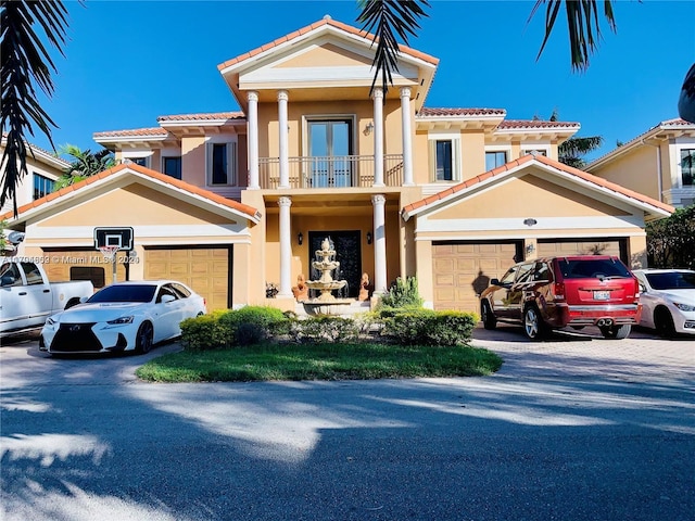 view of front facade with a balcony and a garage