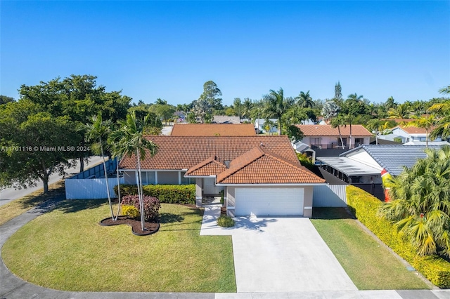 view of front of home featuring a garage and a front lawn