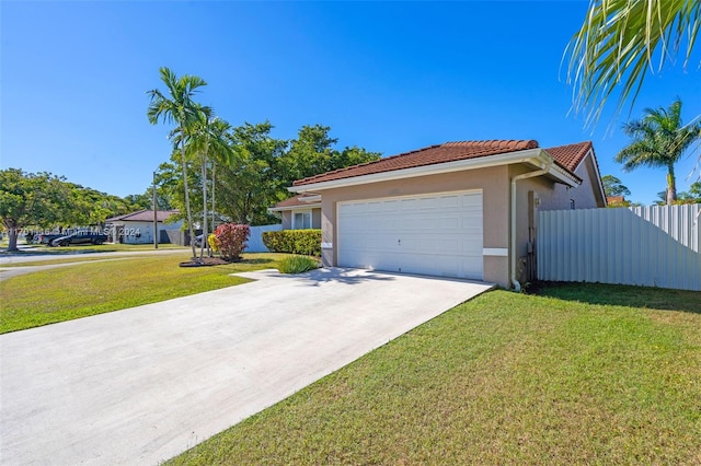 view of front of house featuring a front yard and a garage