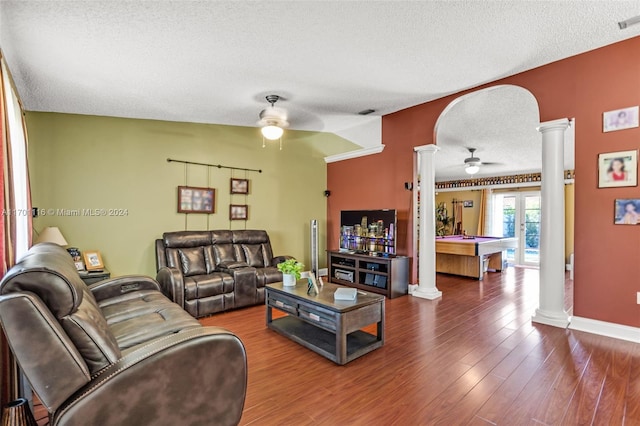 living room with hardwood / wood-style floors, ceiling fan, a textured ceiling, and pool table