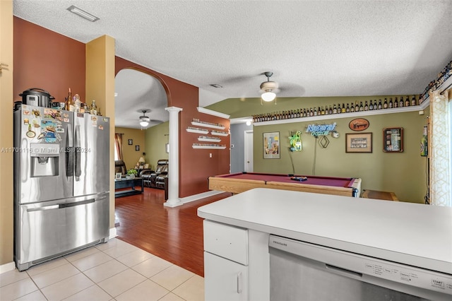 kitchen featuring appliances with stainless steel finishes, light wood-type flooring, vaulted ceiling, ceiling fan, and billiards