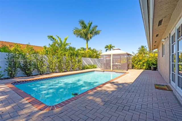 view of swimming pool with a gazebo and a patio