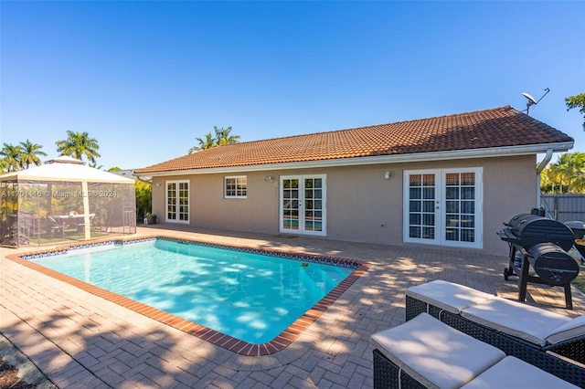 view of pool featuring a gazebo, a patio area, and french doors