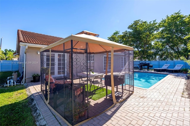 view of pool with a gazebo and a patio