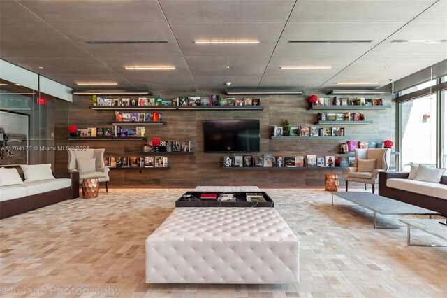 living room featuring floor to ceiling windows and wood-type flooring