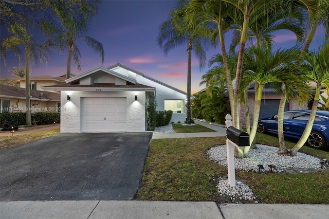 view of front of home with a garage