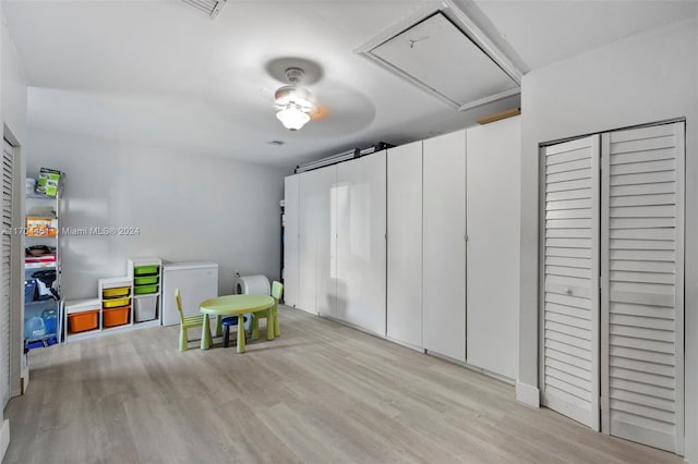 game room with light wood-type flooring