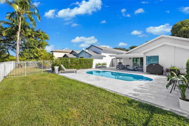 view of swimming pool featuring grilling area, a yard, a patio, and an outdoor hangout area