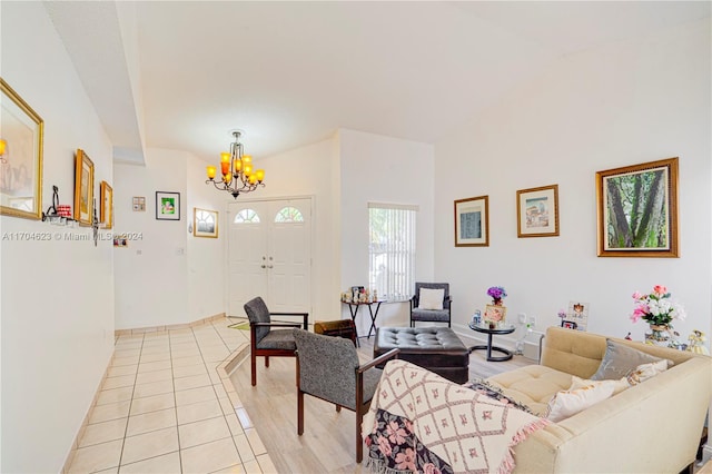 tiled living room featuring a chandelier