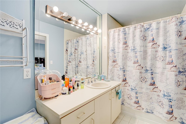 bathroom featuring tile patterned floors, vanity, and shower / bath combo