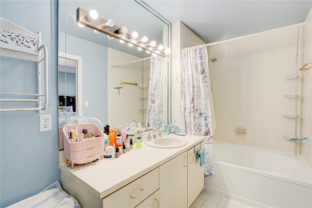 bathroom with tile patterned flooring, vanity, and shower / tub combo