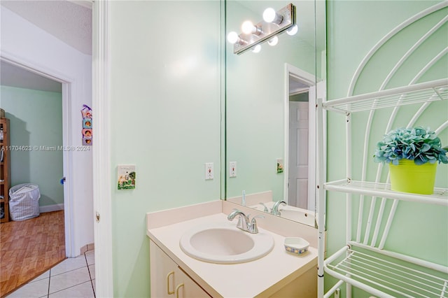 bathroom featuring tile patterned floors and vanity