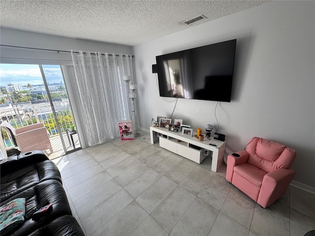 tiled living room with a textured ceiling