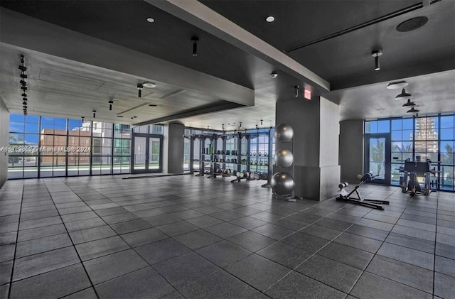 gym with a healthy amount of sunlight and a wall of windows