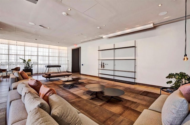 living room featuring floor to ceiling windows and wood-type flooring