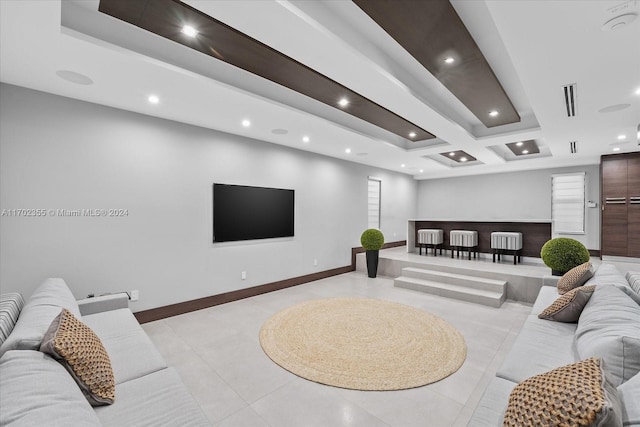 living room featuring beam ceiling and light tile patterned flooring