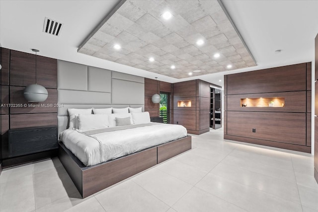 bedroom featuring a raised ceiling