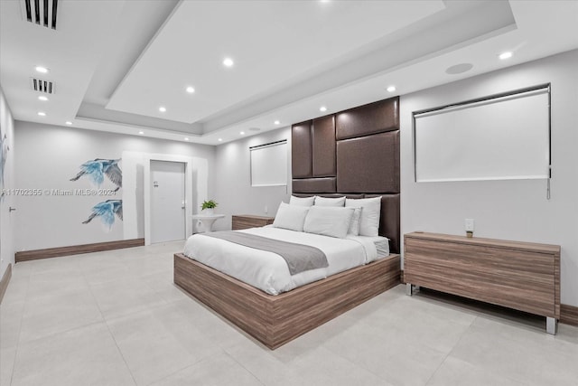 bedroom with a tray ceiling