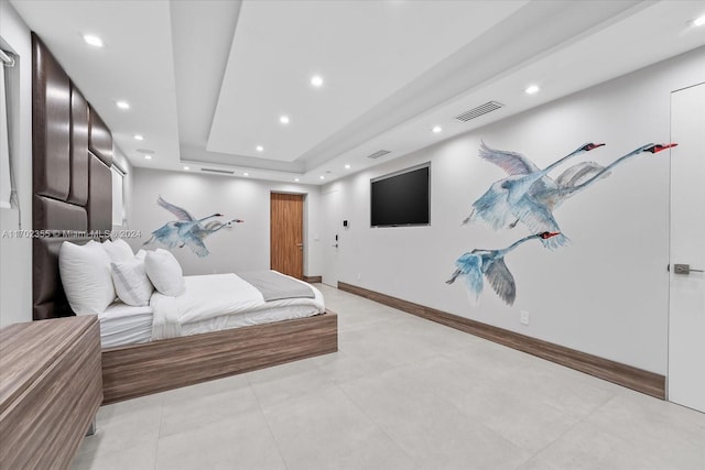 bedroom with a tray ceiling