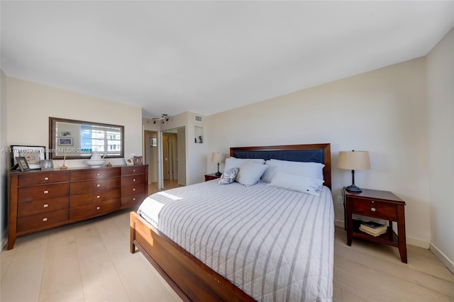 bedroom with light hardwood / wood-style floors