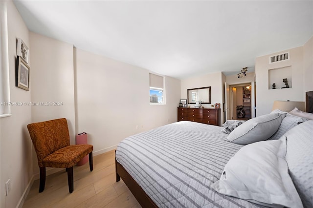 bedroom with light wood-type flooring