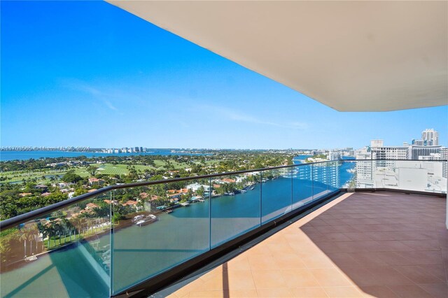 balcony featuring a water view