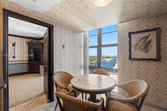 5500 Collins Ave Unit 2302, Miami Beach, FL 33140 - dining space with light stone finish flooring and wallpapered walls
