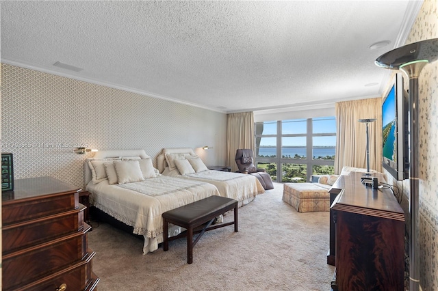 5500 Collins Ave Unit 2302, Miami Beach, FL 33140 - carpeted bedroom featuring ornamental molding and a textured ceiling