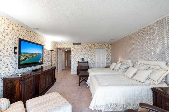 carpeted bedroom with crown molding and a textured ceiling