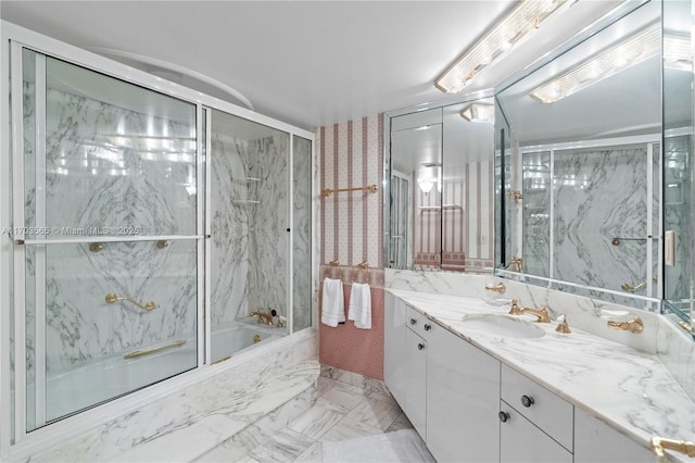 5500 Collins Ave Unit 2302, Miami Beach, FL 33140 - bathroom featuring vanity, combined bath / shower with glass door, and marble finish flooring