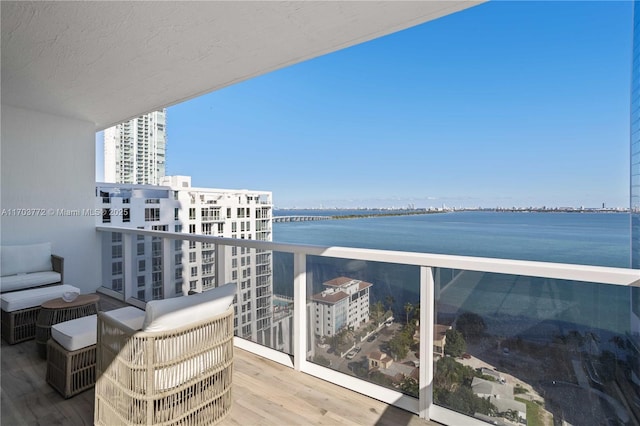 balcony featuring a water view