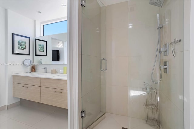 bathroom featuring tile patterned floors, vanity, and a shower with shower door