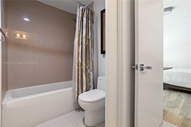 bathroom with shower / bathtub combination with curtain and toilet