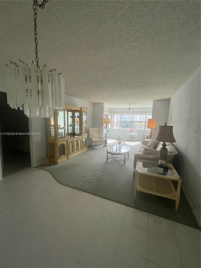 unfurnished living room featuring a textured ceiling and tile patterned floors