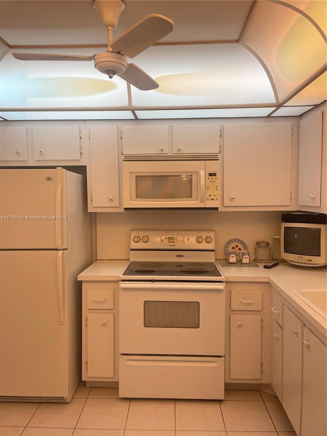 kitchen featuring white cabinets, ceiling fan, white appliances, and light tile patterned floors