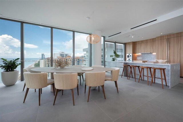 dining area featuring a wall of windows